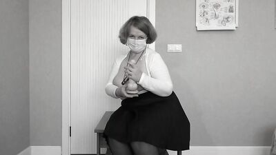 Mature busty teacher fucks her holes to orgasm.