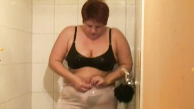 Watch Annadevot get soaking wet while playing with herself in the shower