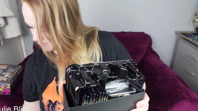 Blonde gamer joins behind the scenes of a Pokemon Card Unboxing with nerdy cosplay girl Julie Bliss