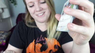 Blonde gamer joins behind the scenes of a Pokemon Card Unboxing with nerdy cosplay girl Julie Bliss