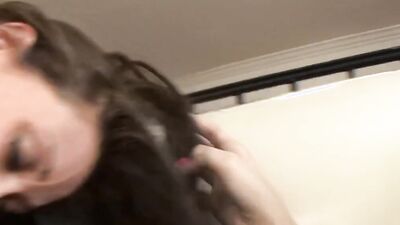 Pretty lesbian girls are kissing and lovemaking on the couch