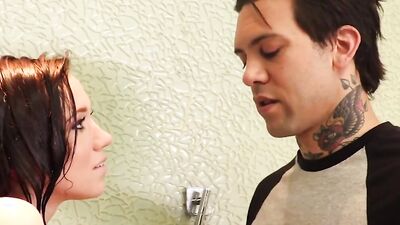 Bailey Brooke is being fucked by a tattooed man under the shower