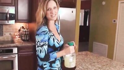 Slutty blonde MILF is spanked and fucked in the kitchen