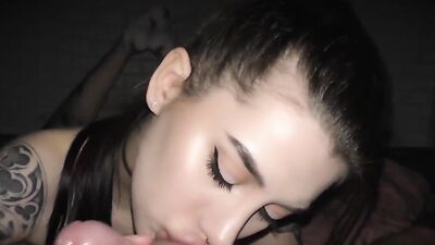Amateur girl seductively stares at the camera while sucking a dick