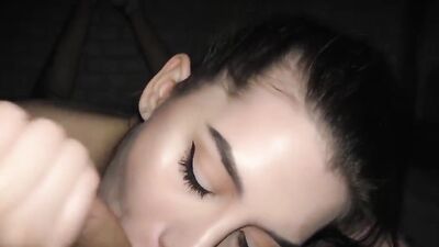 Amateur girl seductively stares at the camera while sucking a dick