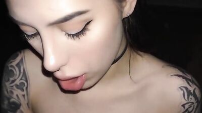 Amateur girl seductively stares at the camera while sucking a dick