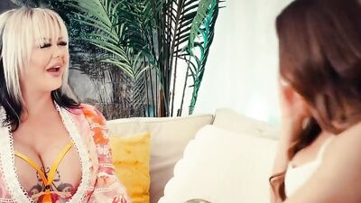 Two classy girls are making out and undressing on the couch