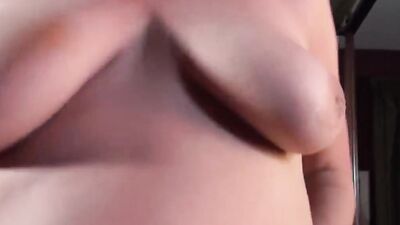 POV video shows busty MILF playing with pussy and saggy tits