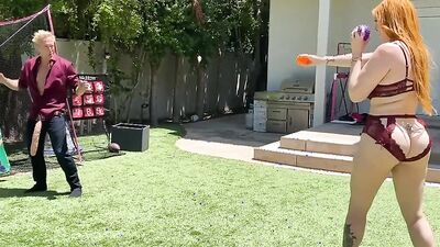 Redhead cougar sucks a massive dildo and gets poked with it