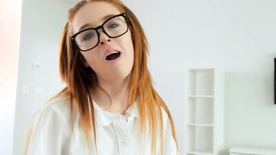 Nerdy redhead girl polishes a hard cock and rides it wildly