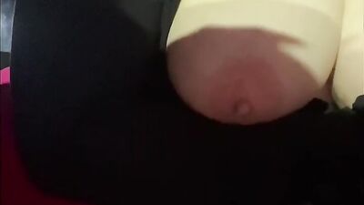 MILF takes her big natural tits out while driving a car