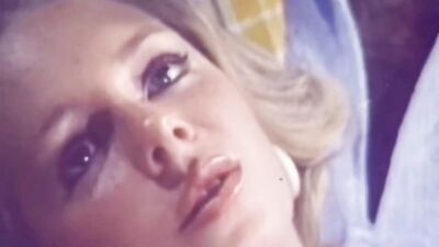 Classic porn video shows two juicy blondes sharing a cock