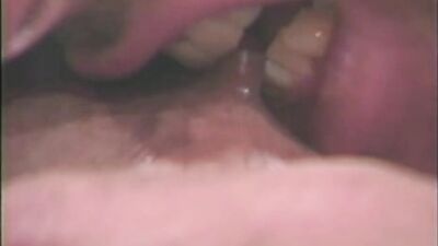 Vintage porn video shows amazing brunette playing with a big cock
