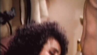 Vintage porn video shows a busty brunette riding hard cock
