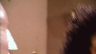 Vintage porn video shows a busty brunette riding hard cock