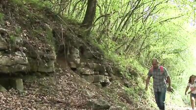 Brunette girl blows old man in the woods and gets fucked
