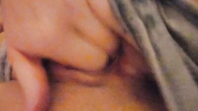 Hot girl masterbates in sock and pigtails on couch