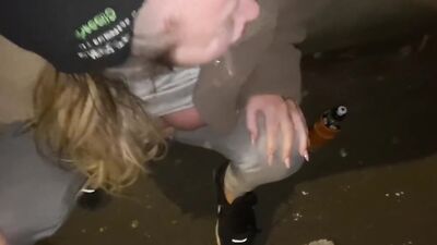 Street woman is offered a drink to take a cum shot
