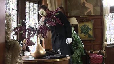 A brunette satisfies the masked man's horny cravings