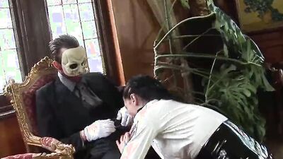 A brunette satisfies the masked man's horny cravings