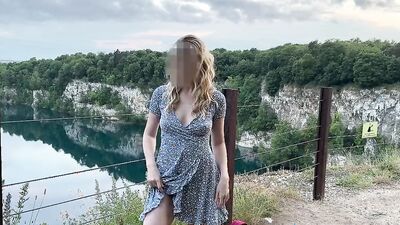Hot blonde is pumping shaved pussy outside in public park and flashes her big pumped pussy