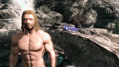 A muscular man & a busty redhead have public sex.